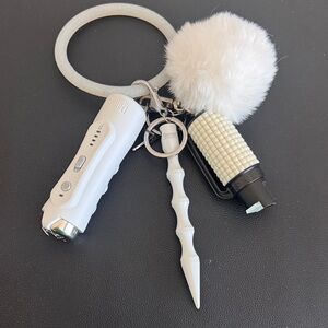 Damsel in Defense White Pom Pom Comfy Wrist Keychain with Personal Safety Tools